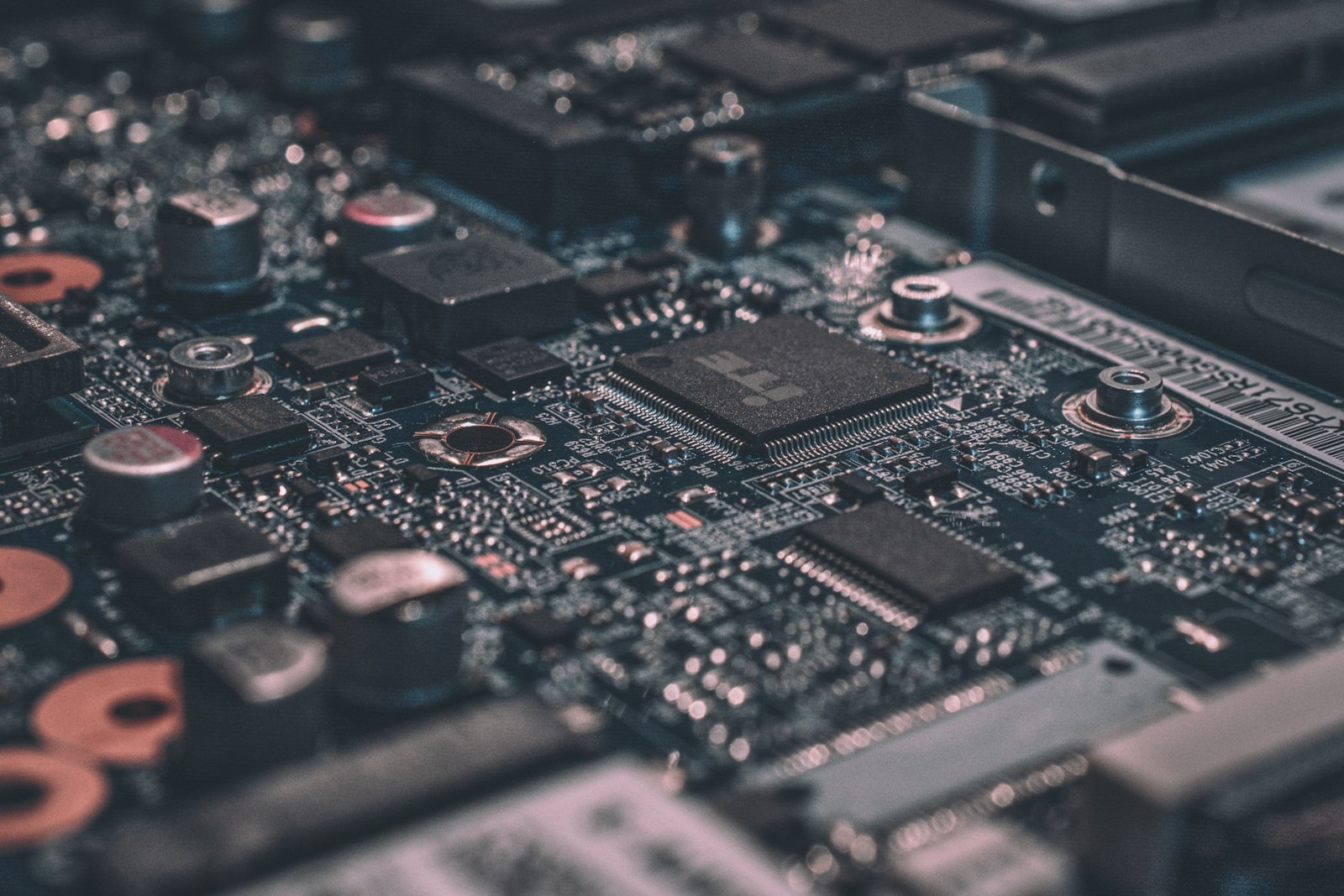 Extreme macro close-up of a black circuit board and its components
